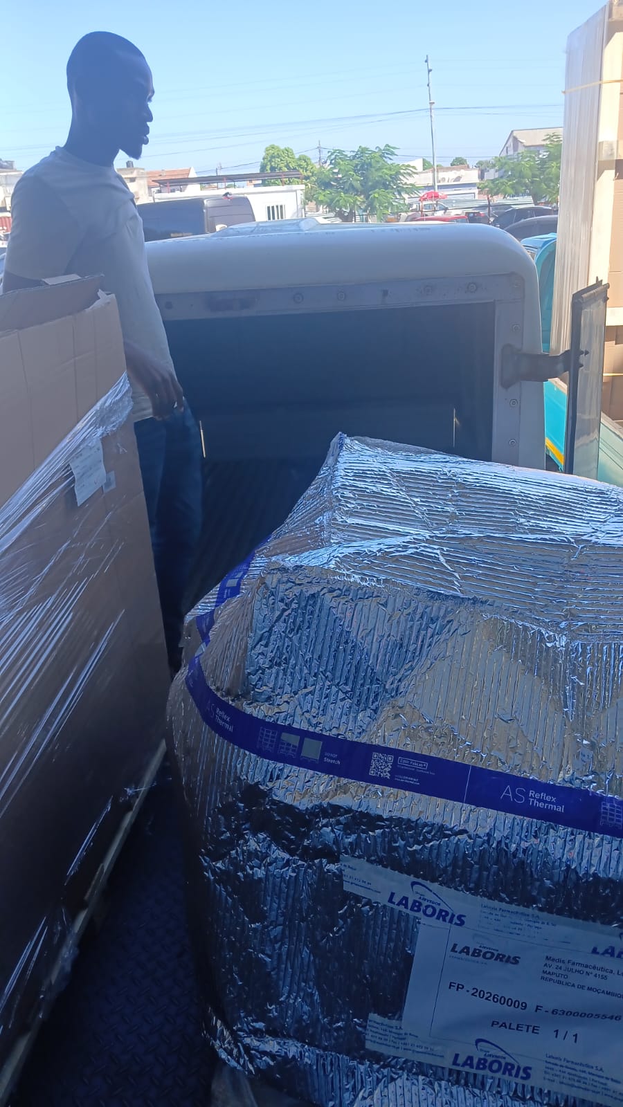 Worker loading pharma pallet